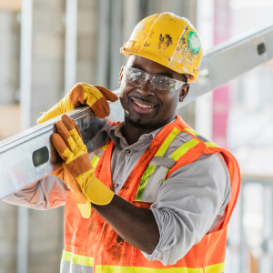 The Strength for a Hard Day's Work A strong construction worker carrying a heavy beam, representing the need for physical endurance and joint support in demanding jobs.